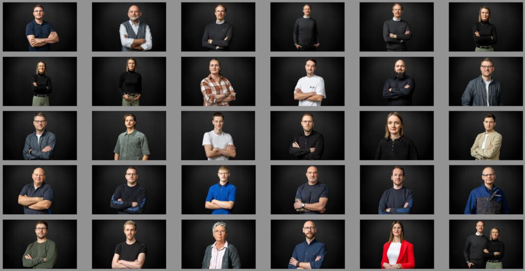 Mitarbeiterportraits für Lenkering in Steinfeld vor schwarzer Wand, Übersicht des Teams