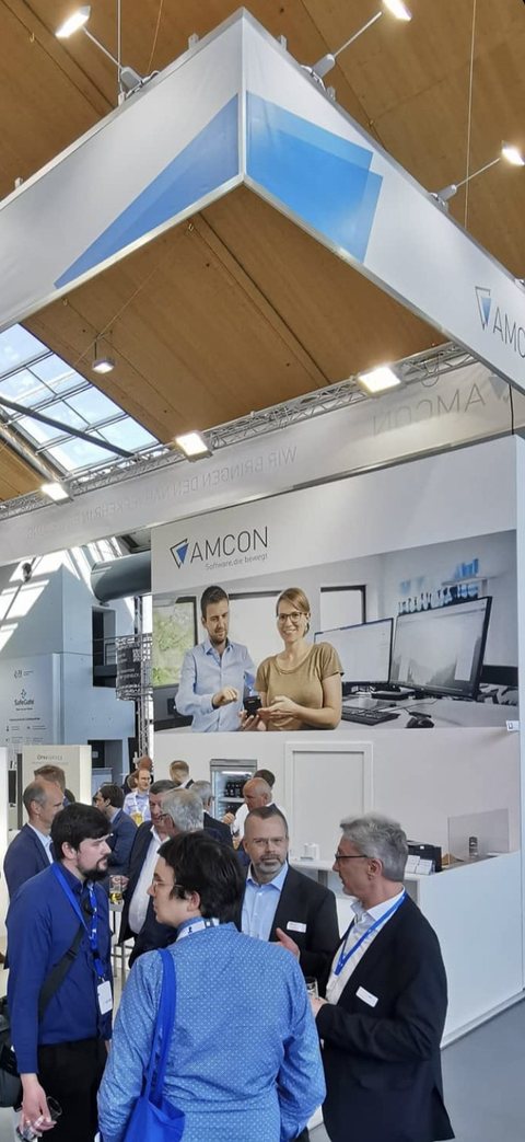 Messestand von AMCON mit unserem Bild als großer Messewand