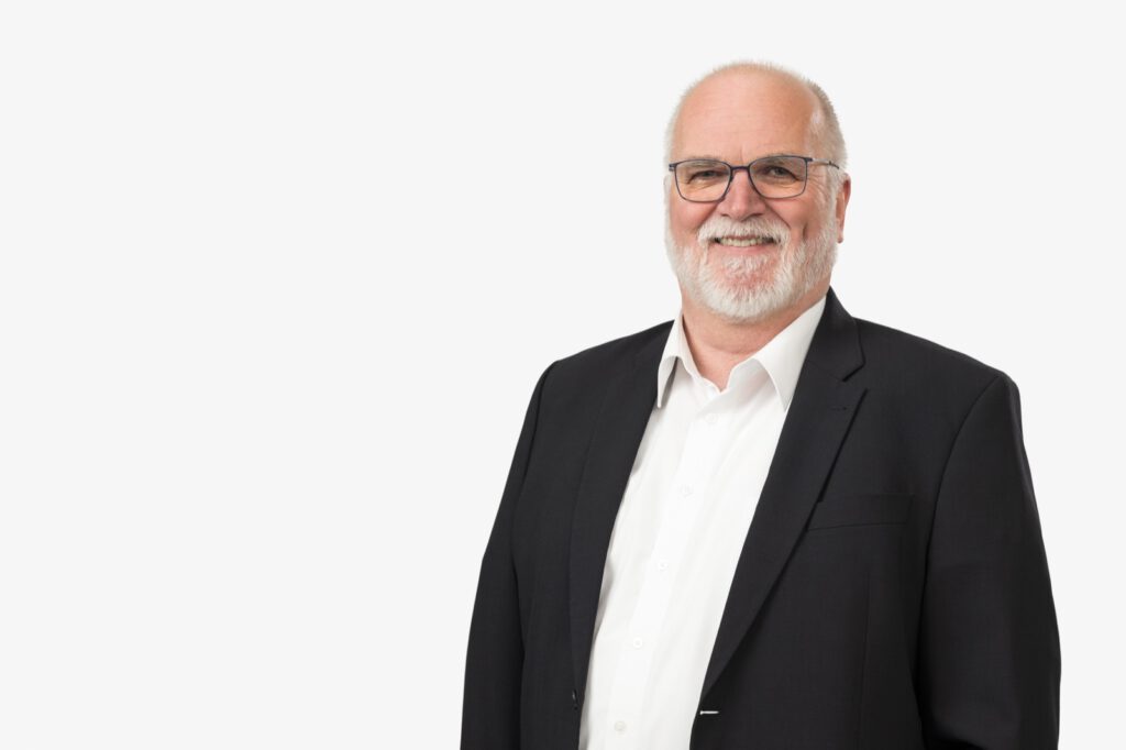Portrait von Dr. Heiko Greimann, Geschäftsführer von Biochem, vor weißem Hintergrund